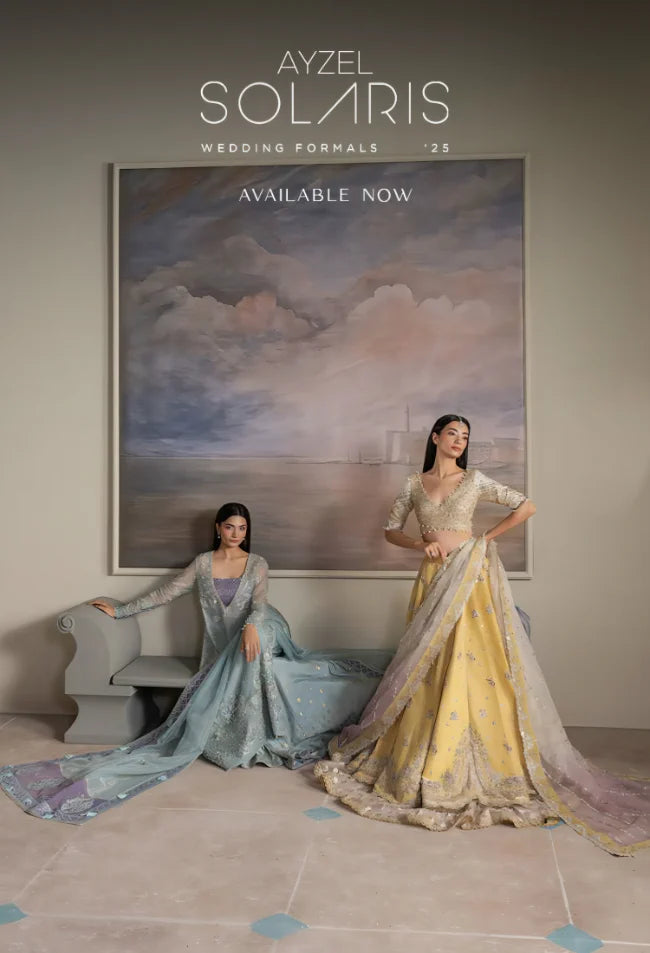 Two women in elegant dresses standing in front of a painting with 'Ayzel Solaris' branding.