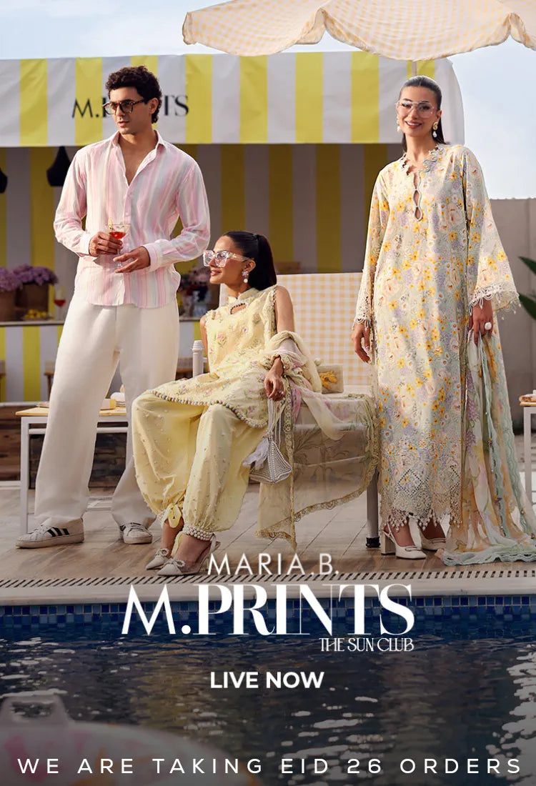Promotional image of a fashion brand with models in outdoor setting, featuring 'Maria B M. Prints' branding Eid Dresses UK.