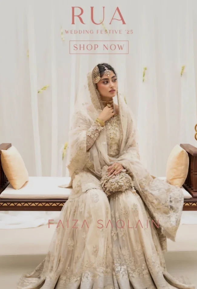 Woman in a traditional outfit with 'Faiza Saqlain' branding in the background